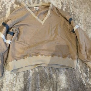 Cute, tan, v neck, off the shoulder sweater.